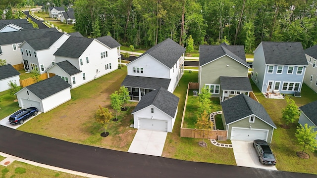 aerial perspective of suburban area featuring a heavily wooded area