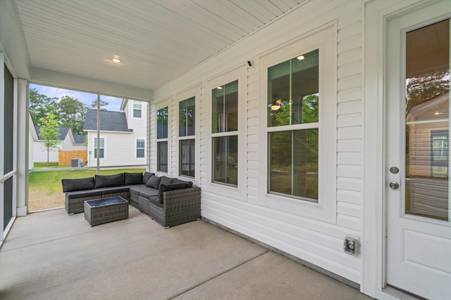 sunroom / solarium featuring outdoor lounge area