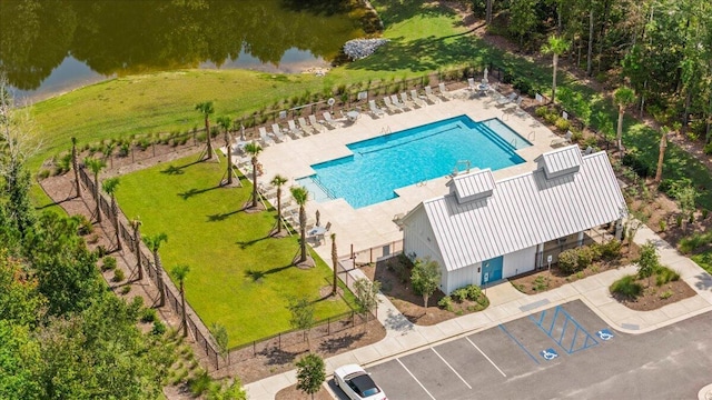aerial view of a pool and a large body of water