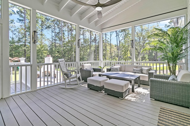 sunroom with wooden ceiling, vaulted ceiling with beams, and a ceiling fan