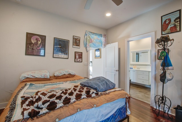 bedroom featuring a ceiling fan, ensuite bath, recessed lighting, and wood finished floors