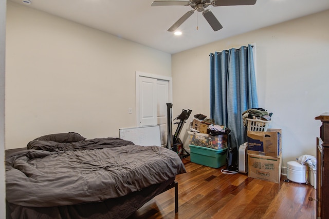 bedroom with a ceiling fan and wood finished floors