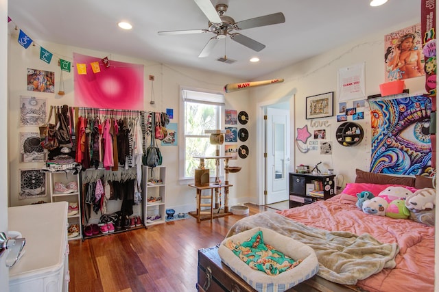 bedroom featuring visible vents, baseboards, recessed lighting, wood finished floors, and a ceiling fan