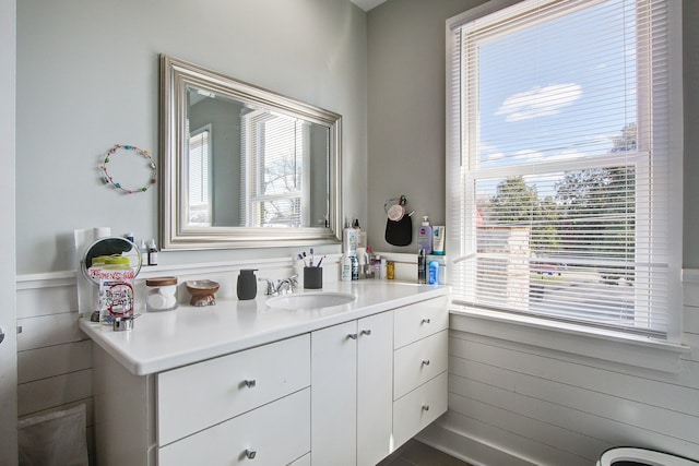 bathroom with wainscoting and vanity