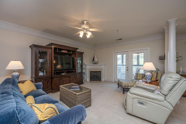 living room featuring crown molding, light colored carpet, and ceiling fan