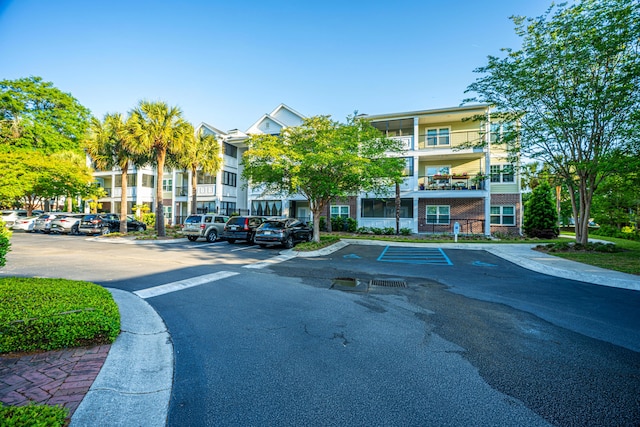 view of property featuring uncovered parking