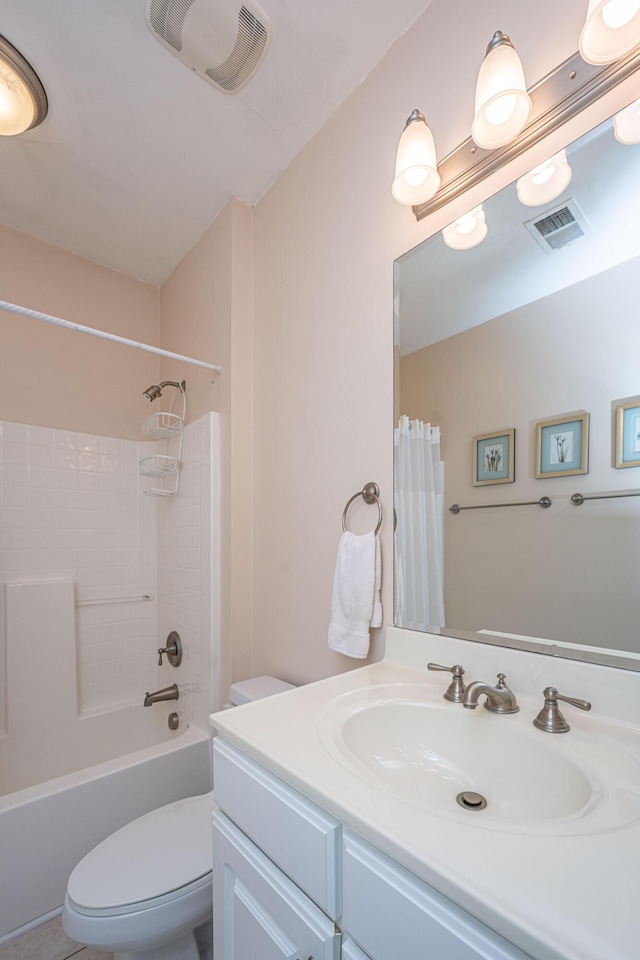full bath featuring visible vents, toilet, vanity, and shower / bath combo with shower curtain