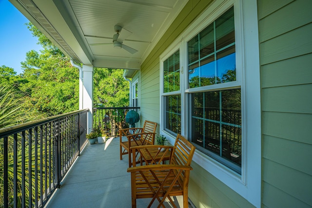 balcony with a porch and ceiling fan