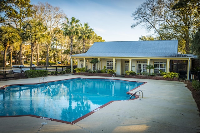 community pool with a patio area