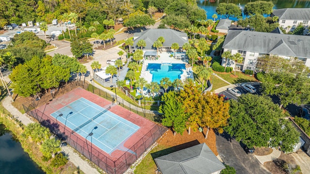 drone / aerial view featuring a residential view and a water view