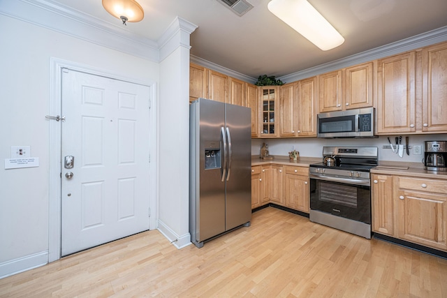 kitchen featuring light countertops, light wood-style floors, visible vents, and appliances with stainless steel finishes