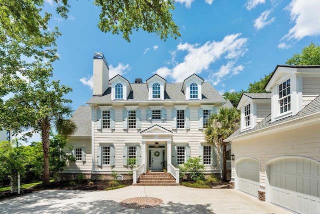 3508 Henrietta Hartford Rd, Mount Pleasant, SC 29466 - colonial house with driveway, a chimney, a garage, and roof with shingles