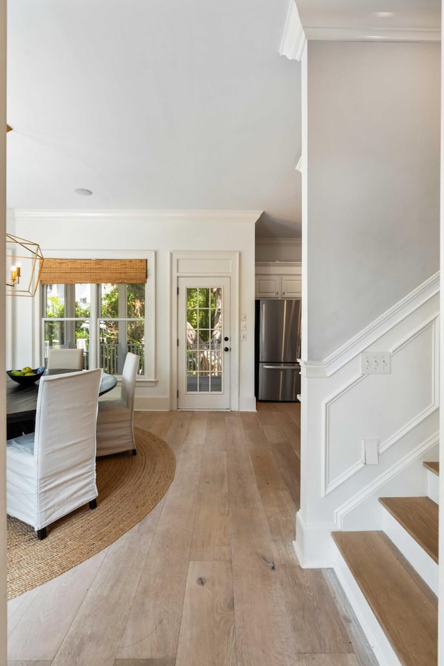 3508 Henrietta Hartford Rd, Mount Pleasant, SC 29466 - entryway with a chandelier, light wood-style flooring, stairway, and crown molding