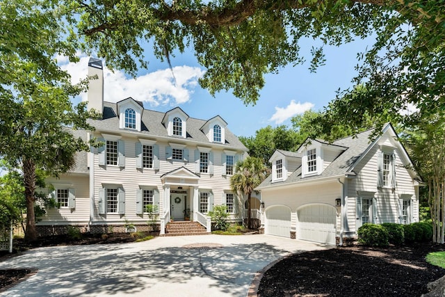3508 Henrietta Hartford Rd, Mount Pleasant, SC 29466 - colonial-style house with driveway, an attached garage, a chimney, and roof with shingles