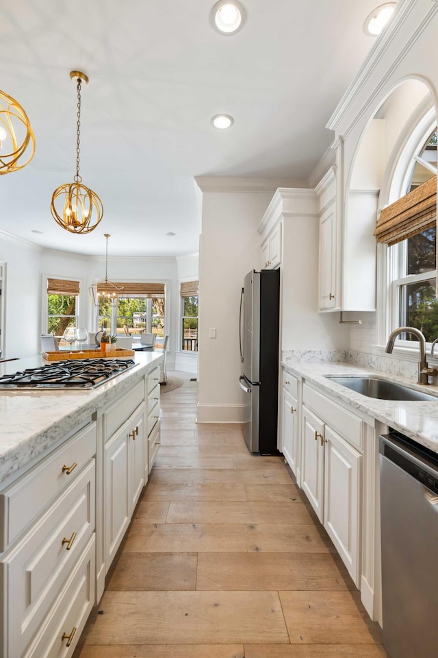 3508 Henrietta Hartford Rd, Mount Pleasant, SC 29466 - kitchen featuring appliances with stainless steel finishes, a sink, white cabinets, recessed lighting, and pendant lighting
