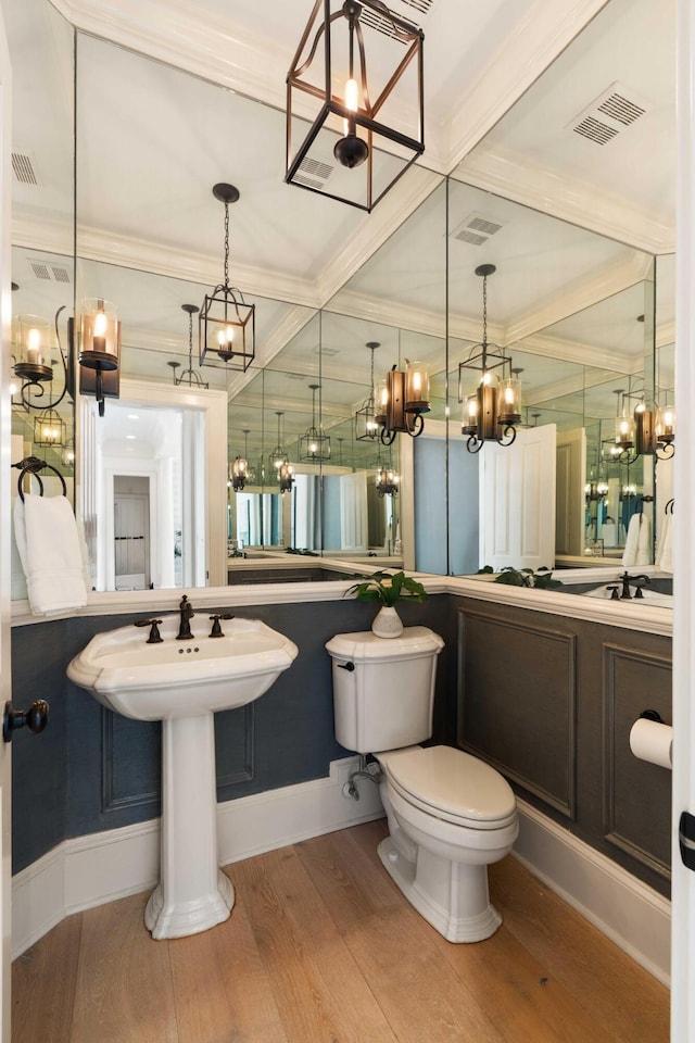 3508 Henrietta Hartford Rd, Mount Pleasant, SC 29466 - bathroom featuring coffered ceiling, wood finished floors, toilet, a chandelier, and crown molding