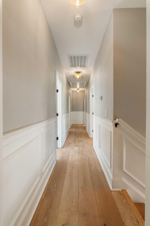 3508 Henrietta Hartford Rd, Mount Pleasant, SC 29466 - corridor with a wainscoted wall, light wood-type flooring, and attic access