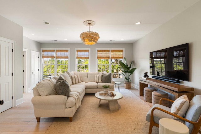 3508 Henrietta Hartford Rd, Mount Pleasant, SC 29466 - living room featuring light wood-style flooring, a chandelier, baseboards, and recessed lighting