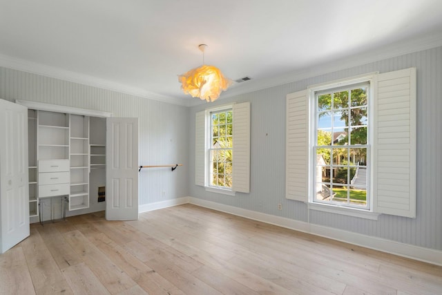 3508 Henrietta Hartford Rd, Mount Pleasant, SC 29466 - unfurnished bedroom featuring crown molding, hardwood / wood-style flooring, baseboards, and a closet