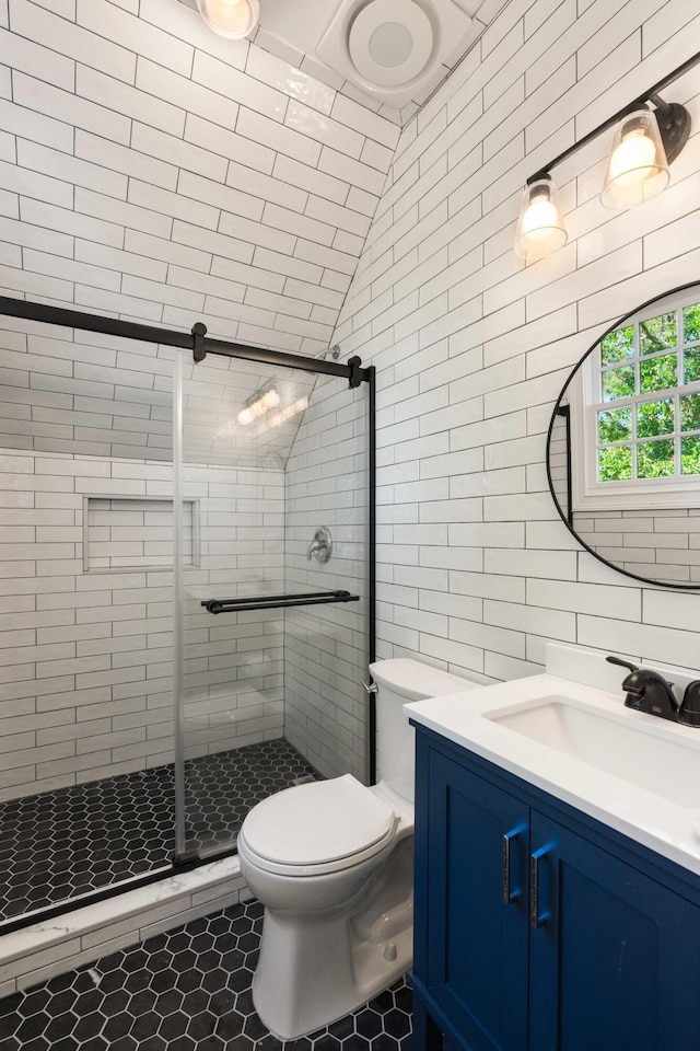 3508 Henrietta Hartford Rd, Mount Pleasant, SC 29466 - bathroom featuring tile patterned floors, toilet, a shower stall, vanity, and tile walls