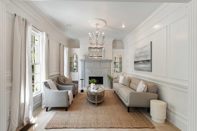 3508 Henrietta Hartford Rd, Mount Pleasant, SC 29466 - living area featuring a decorative wall, a chandelier, a high end fireplace, ornamental molding, and recessed lighting