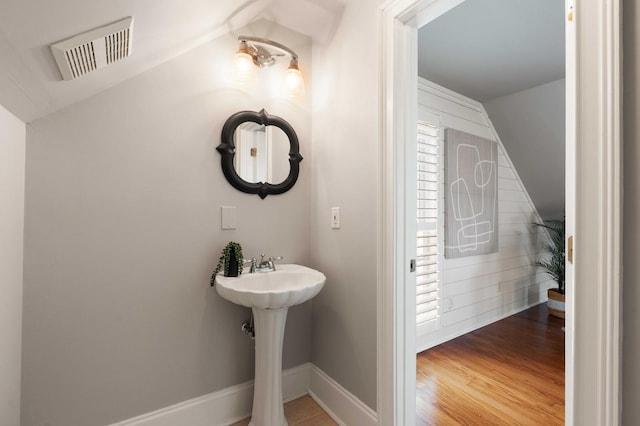 3508 Henrietta Hartford Rd, Mount Pleasant, SC 29466 - bathroom with vaulted ceiling, wood finished floors, and baseboards