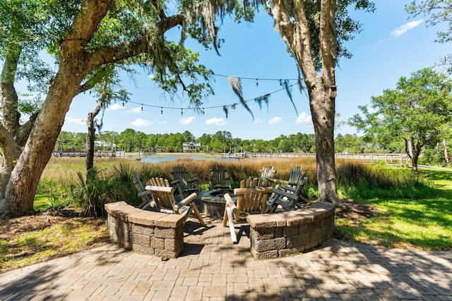 3508 Henrietta Hartford Rd, Mount Pleasant, SC 29466 - view of patio with a water view, a fire pit, and view of scattered trees