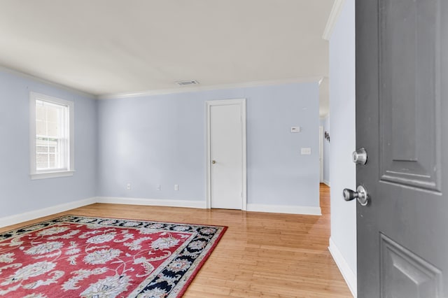 21 Rivers Point Row Unit 17G, Charleston, SC 29412 - unfurnished room with light wood finished floors, ornamental molding, and baseboards