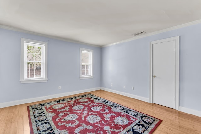 21 Rivers Point Row Unit 17G, Charleston, SC 29412 - empty room featuring crown molding, wood finished floors, and baseboards