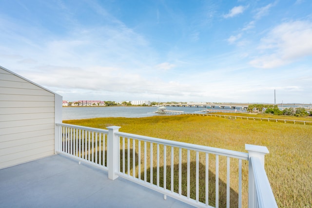 balcony featuring a water view