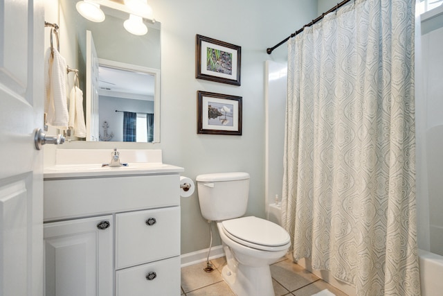 full bathroom featuring vanity, tile patterned floors, crown molding, toilet, and shower / bath combo with shower curtain