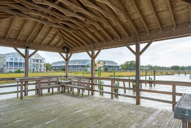 view of dock featuring a gazebo and a water view