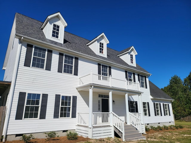 view of front facade with a porch and a balcony