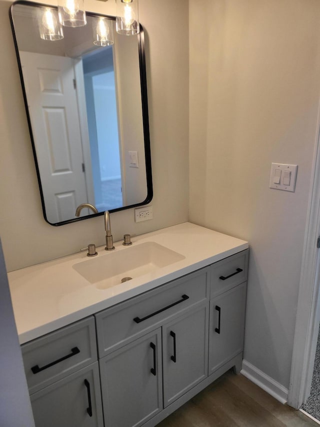 bathroom featuring vanity and wood-type flooring