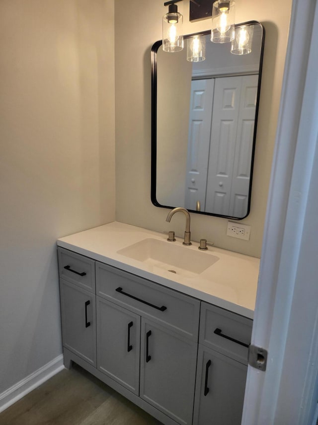 bathroom with vanity and hardwood / wood-style floors