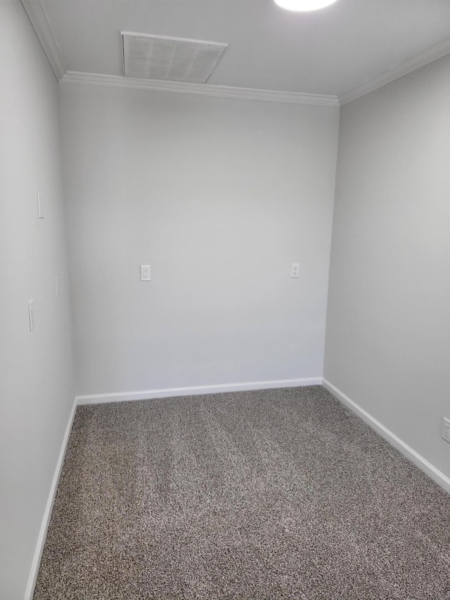 carpeted spare room with crown molding