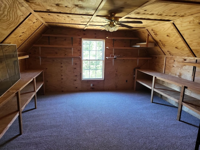 additional living space featuring lofted ceiling and ceiling fan