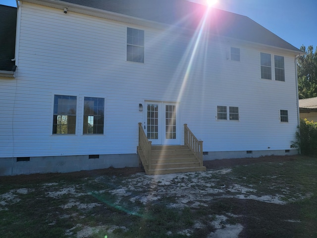 view of back house at dusk