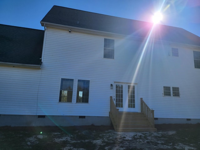 view of back house at dusk