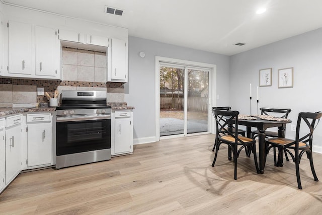 kitchen with white cabinetry, electric range, light hardwood / wood-style flooring, and decorative backsplash