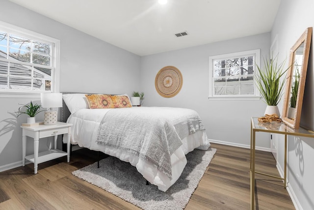 bedroom with wood-type flooring