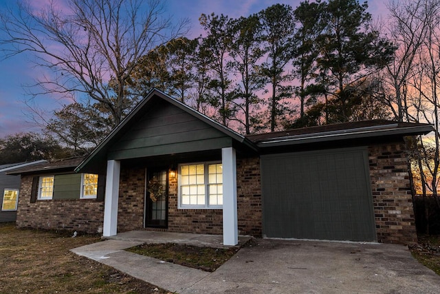 ranch-style home featuring a garage