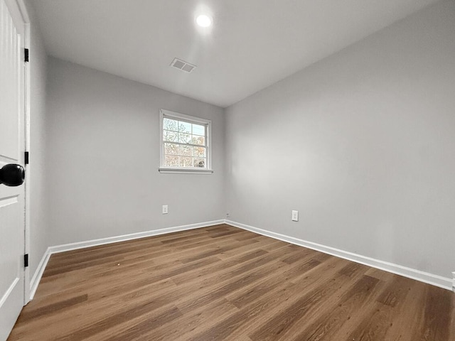 empty room featuring wood-type flooring