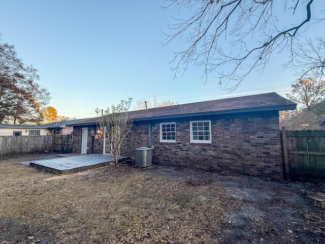 back of property featuring a patio and central air condition unit