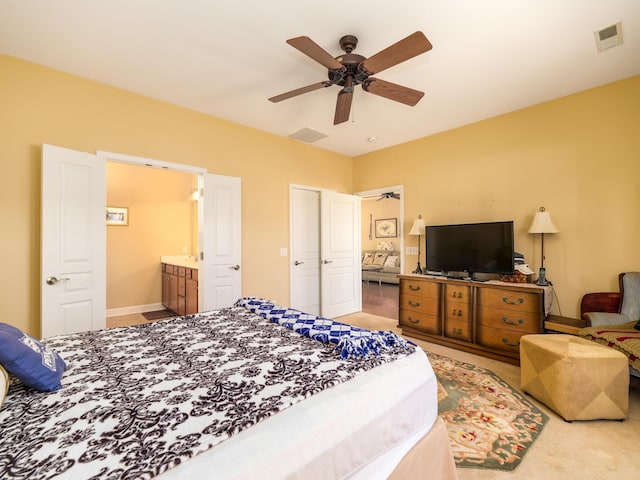 bedroom featuring visible vents, connected bathroom, and a ceiling fan