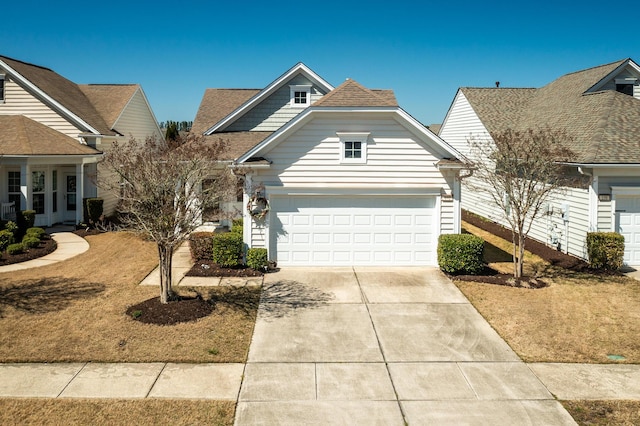 view of front of home featuring driveway and a garage