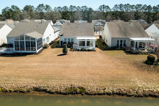 aerial view with a residential view and a water view