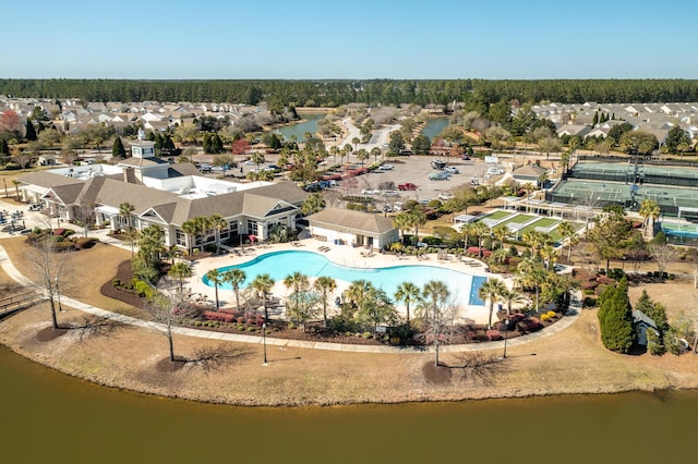 birds eye view of property with a water view and a residential view