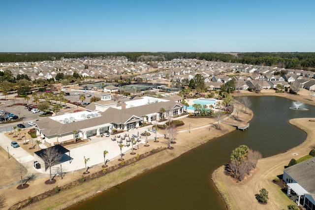 bird's eye view with a residential view and a water view