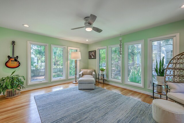 13 32nd Ave, Isle Of Palms, SC 29451 - living area with plenty of natural light, wood finished floors, ceiling fan, and recessed lighting
